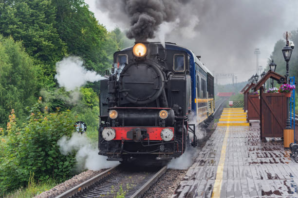 istock Retro steam train approaches to the platform. 1848659947