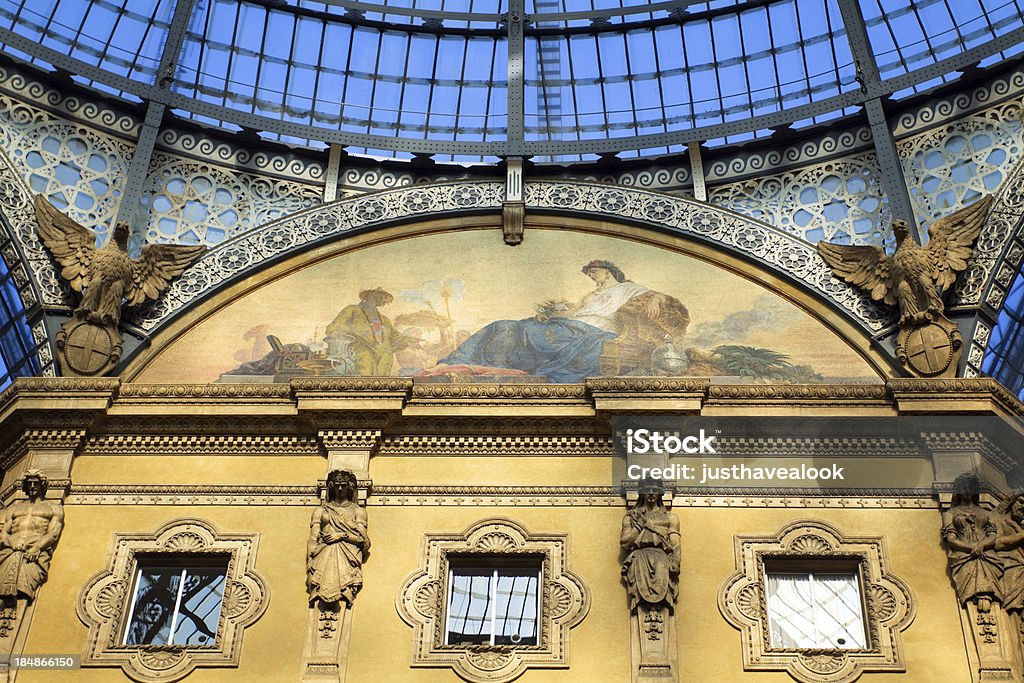 Mosaic in gallery Vittorio Emanuele II. Detail and mosaic in gallery Vittorio Emanuele II. in Milan, Lombardy, Italy. Wonderful shopping gallery Galleria Vittorio Emanuele II. was designed and built in 19th century by Giuseppe Mengoni between 1865 and 1877. It is dedicated to first King of Italian Reunion. In center under dome and cupola are several wonderful mosaics. Architectural Dome Stock Photo