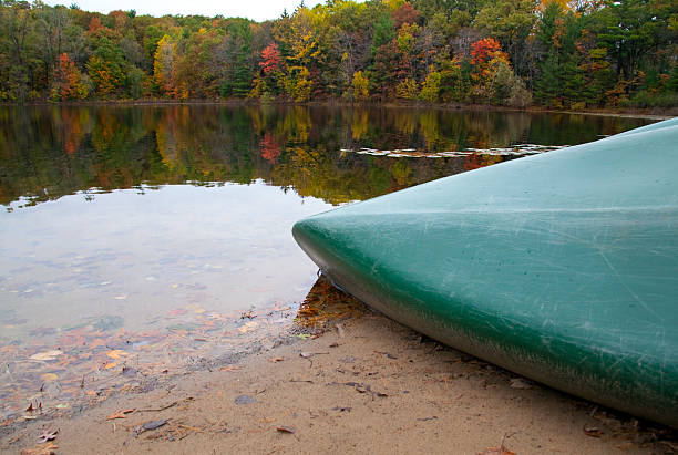 istock Canoe on a Still Lake in Michigan Autumn 184866288
