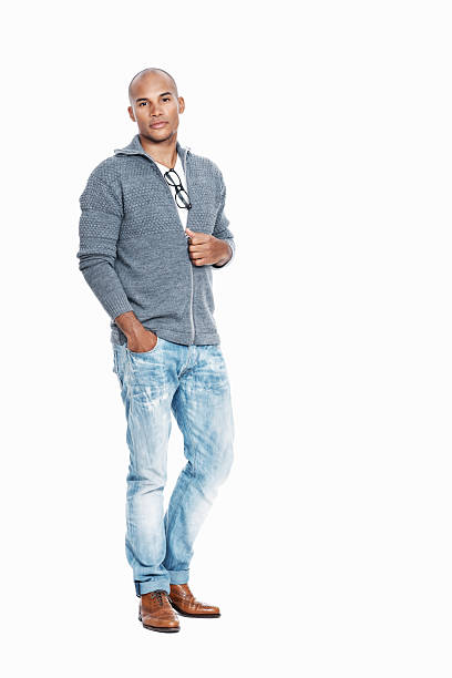 Full length of confident African American male on white background