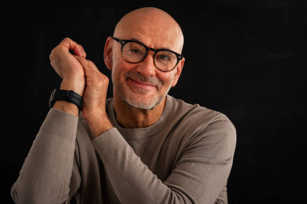 istock Mid aged man studio portrait at black background 1848667213