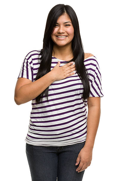 Happy Young Woman With Hand On Heart