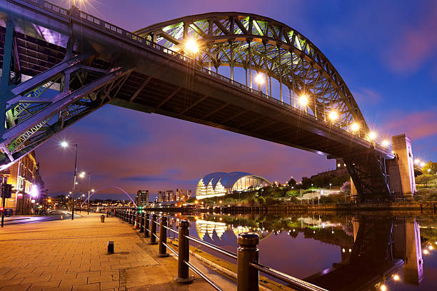 Bridges over the river Tyne in Newcastle, England at night The Tyne Bridge in Newcastle upon Tyne, England. tyne bridge stock pictures, royalty-free photos & images