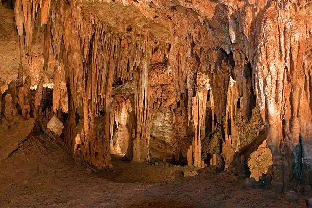 Photo of Cave opening filled with Stalactites