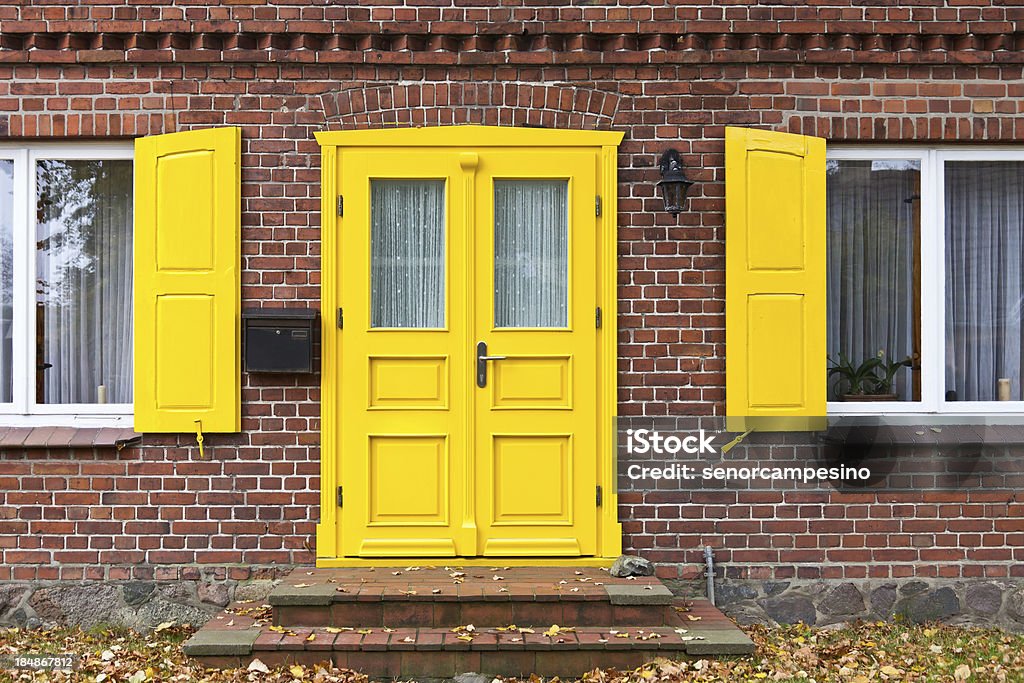 Colorful front door "Colorful front door of an old house in Ahrenshoop on the Fischland-Darss-Zingst peninsula (Mecklenburg-Vorpommern, Germany)." Door Stock Photo