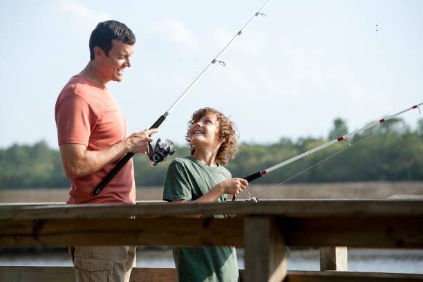 istock Father and son fishing 184867852