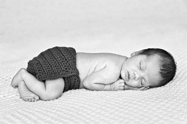 istock Black and White Image of Newborn Baby Boy Sleeping Peacefully 184867956