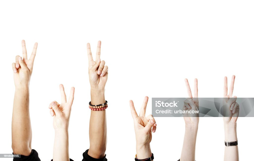 Arms with victory sign Arms raised in the air, making the 'V' for victory sign Peace Sign - Gesture Stock Photo