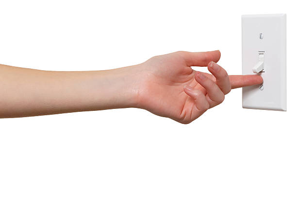 Young Woman with Light Switch Isolated on White Background
