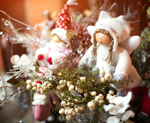 Dolls. Christmas decoration and toys on shiny holiday background.