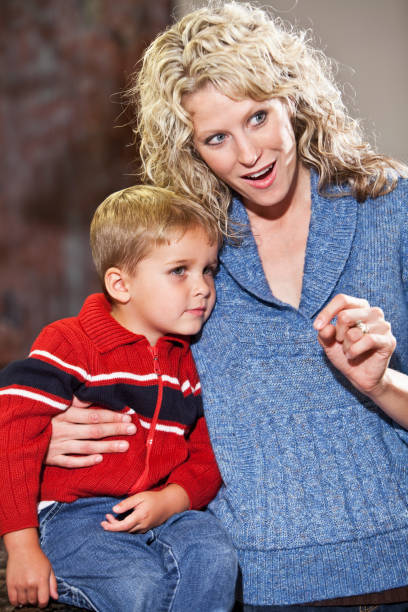 istock Mother talking to little boy, watching 184869027