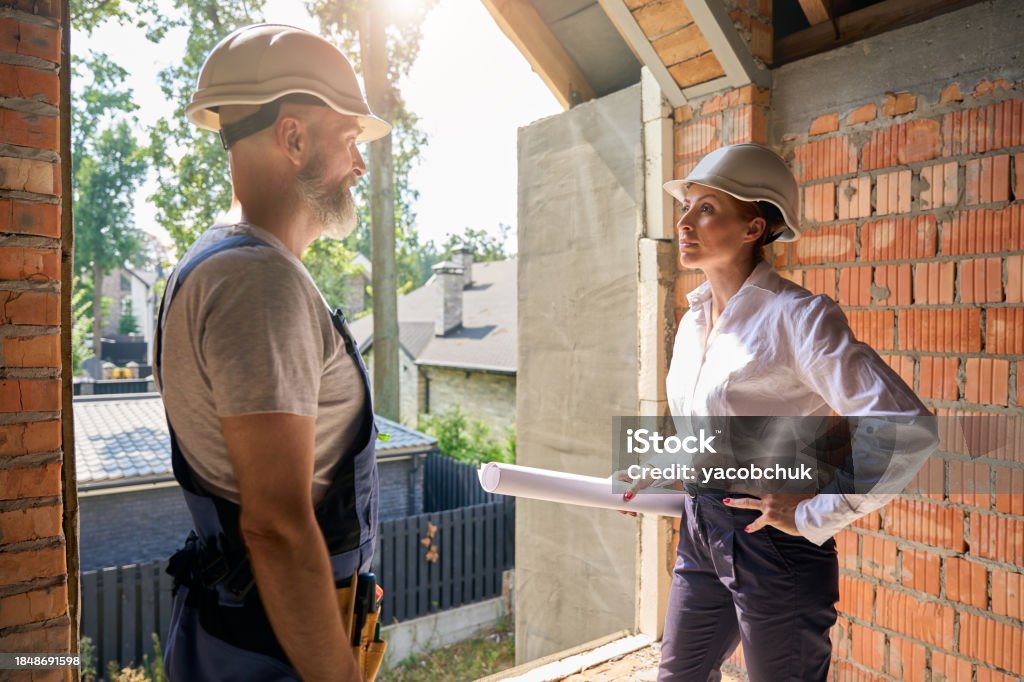 Building Supervisor Reference Construction Supervisor Having Conversation With Builder During Site ...