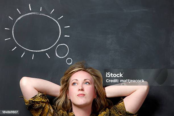 Female Against Blackboard Thinking Stock Photo - Download Image Now - Adult, Adults Only, Black Color