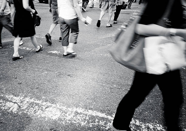 istock People walking on zebra crossing at rush hour 184870440