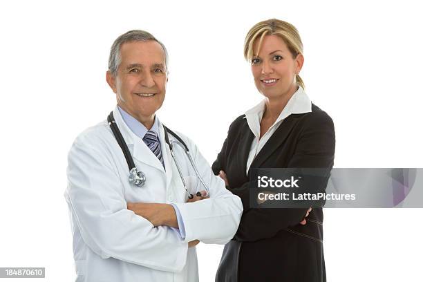 Senior Male Doctor With Businesswoman Arms Crossed Stock Photo - Download Image Now - 30-39 Years, 40-49 Years, 60-69 Years