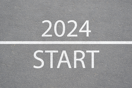 Text on the asphalt Start 2024 top view. New Year, beginning concept.