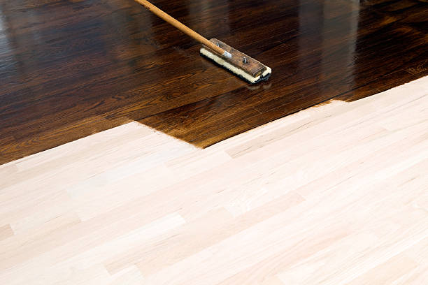 istock Dark Stain Application on New Oak Hardwood Floor 184871036