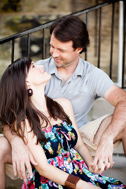 istock Happy Young Couple Sitting on Steps in Downtown Setting 184871868