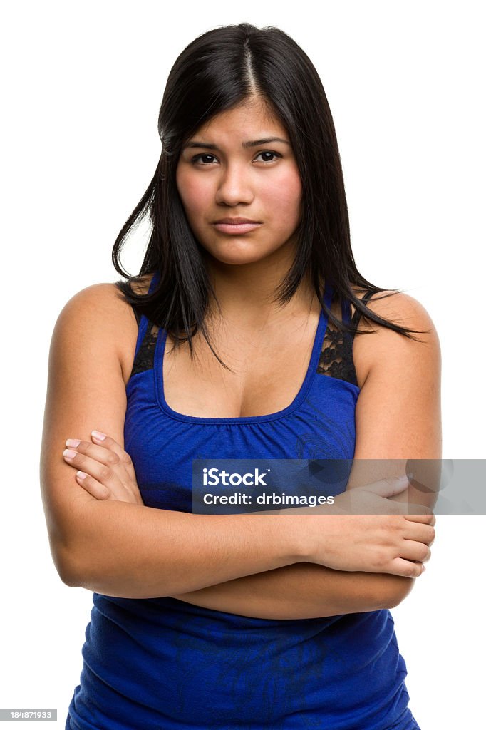 Grave joven mujer atraviesa brazos - Foto de stock de Tristeza libre de derechos