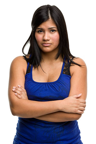 Serious Young Woman Crosses Arms