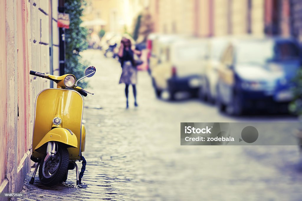 Vespa Scooter in Rome, Italy "Italian urban scene with a Vespa, a very typical italian motorcycle, tilt shift lens" Italy Stock Photo