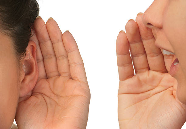istock Women whispering and listening 184872974