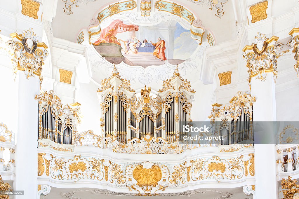 Organ - Pilgrimage Chirch of Wies Pipe Organ of Pilgrimage Church of Wies. The organ is located to the opposite of the altar on a balcony. The church of Wies is an oval Rococo Church near Steingaden at the foothills of the Alps. It was designed by Dominikus Zimmermann in the 1740s and added to the UNESCO World Heritage List in 1983. Altar Stock Photo