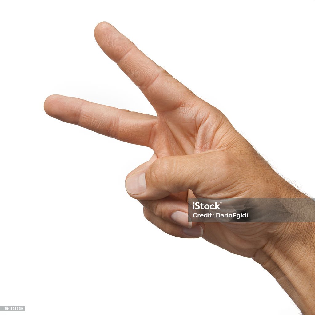 Maschio mano facendo il gesto di forbici su sfondo bianco - Foto stock royalty-free di Adulto