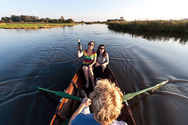 istock friends on a rowing boat 184873514