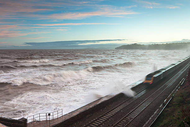 istock Storm at Dawlish with waves over railway 184873568
