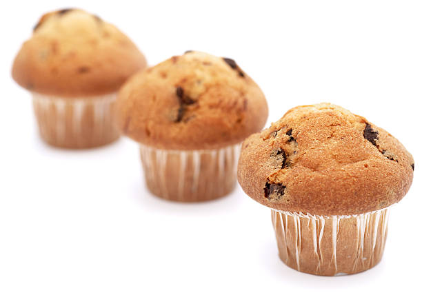 istock Three chocolate chip muffins in a row - shallow DOF 184874451