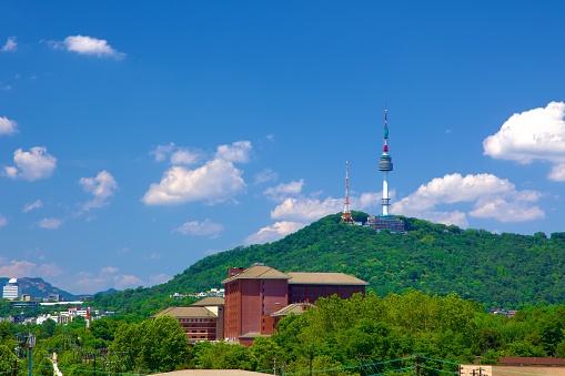 From the vantage point of the National Museum of Korea, Namsan Tower stands majestically atop Namsan Mountain, a symbolic beacon in the Seoul skyline.