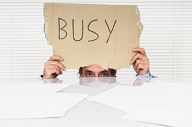 istock Businessman Showing Busy Sign 184874689