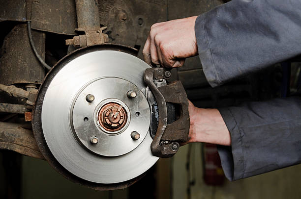 istock Mechanic working on a new set of brakes 184874916