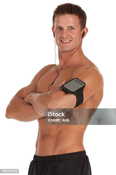 Foto de Homem Musculoso Com Pedômetro Em Seus Braços e mais fotos de stock de 20 Anos - 20 Anos, Adulto, Atleta