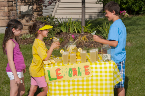 A boy selling lemonade to other childrenClick Here for More of this series: