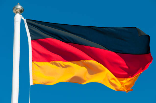 The national flag of Germany waving in the wind National flag of Germany. german flag stock pictures, royalty-free photos & images