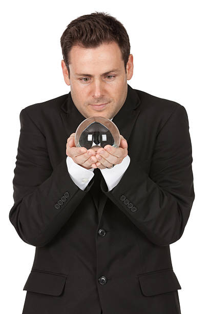 istock Businessman holding a crystal ball 184877332