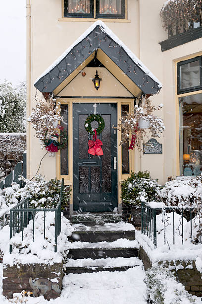 istock front door with Christmas decoration and snowfall 184877536