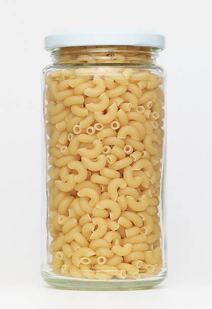 istock Pasta in glass jar on a white background 184877706