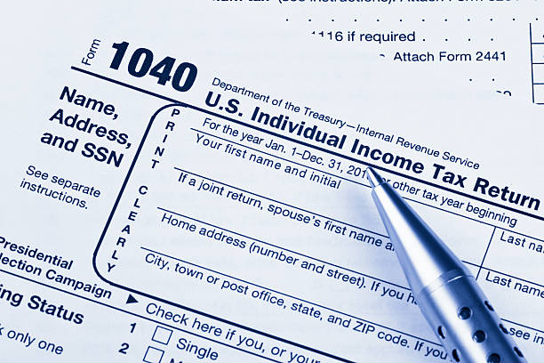 istock US 1040 Tax Return Form with Pen 184878062