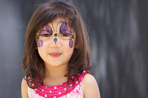 istock Girl with glitter butterfly face 184878120