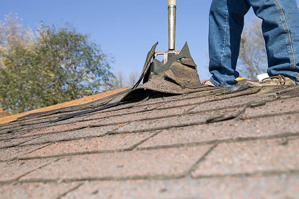 istock Worker Removing Old Shingle Roof for Replacement 184878369