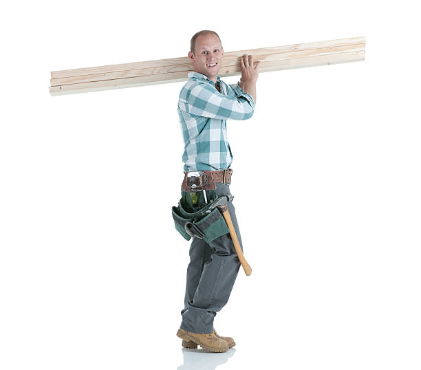 istock Carpenter carrying wooden planks 184878850