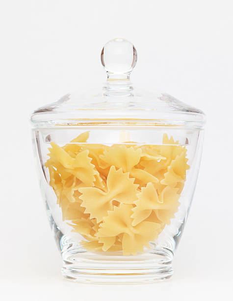 istock Pasta in glass jar on a white background 184879041