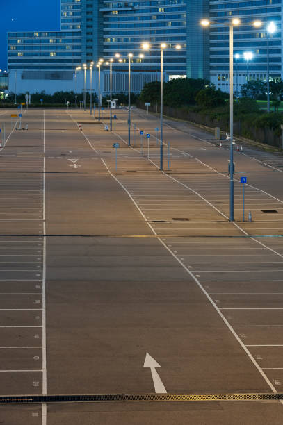 istock empty car park with urban background at night 1848790950