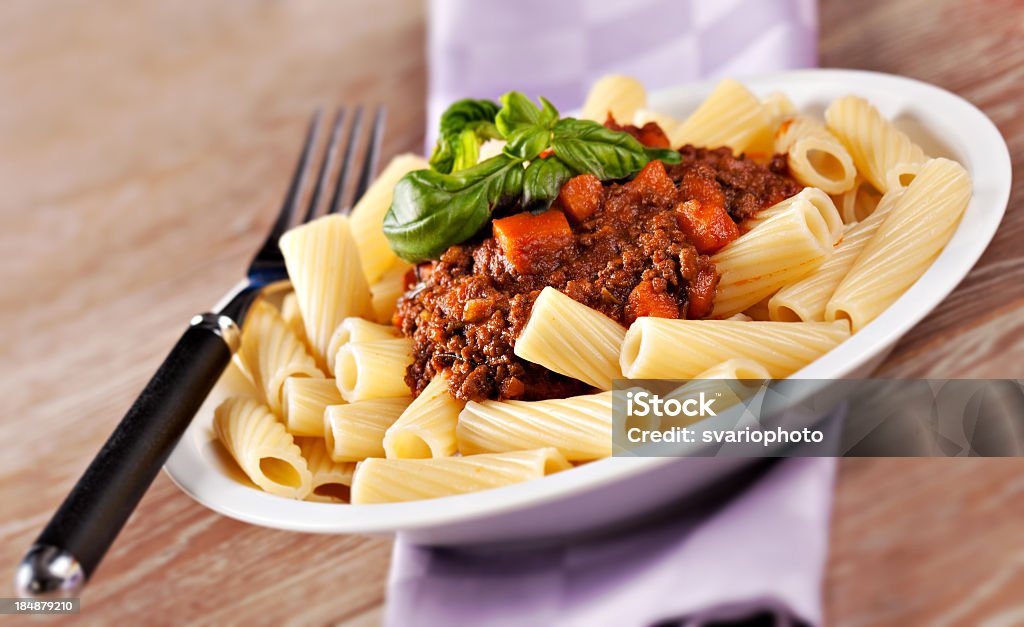 Macaroni Bolognese Macaroni Bolognese. Typical Italian dish. Basil Stock Photo