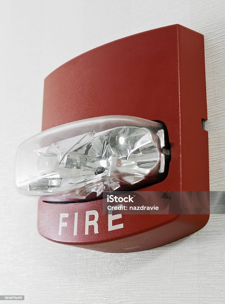 Industrial fire alarm on white wall Red fire alarm with strobe light Fire Alarm Stock Photo