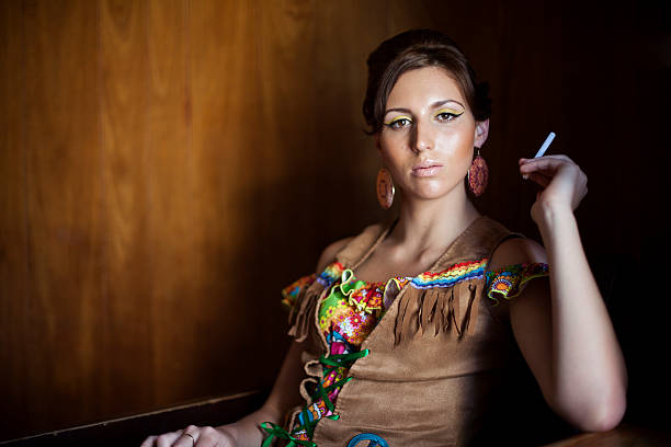 1970s style woman wearing hippy clothes smoking
