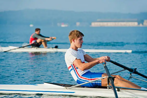 Side view of two rowing men during the race
